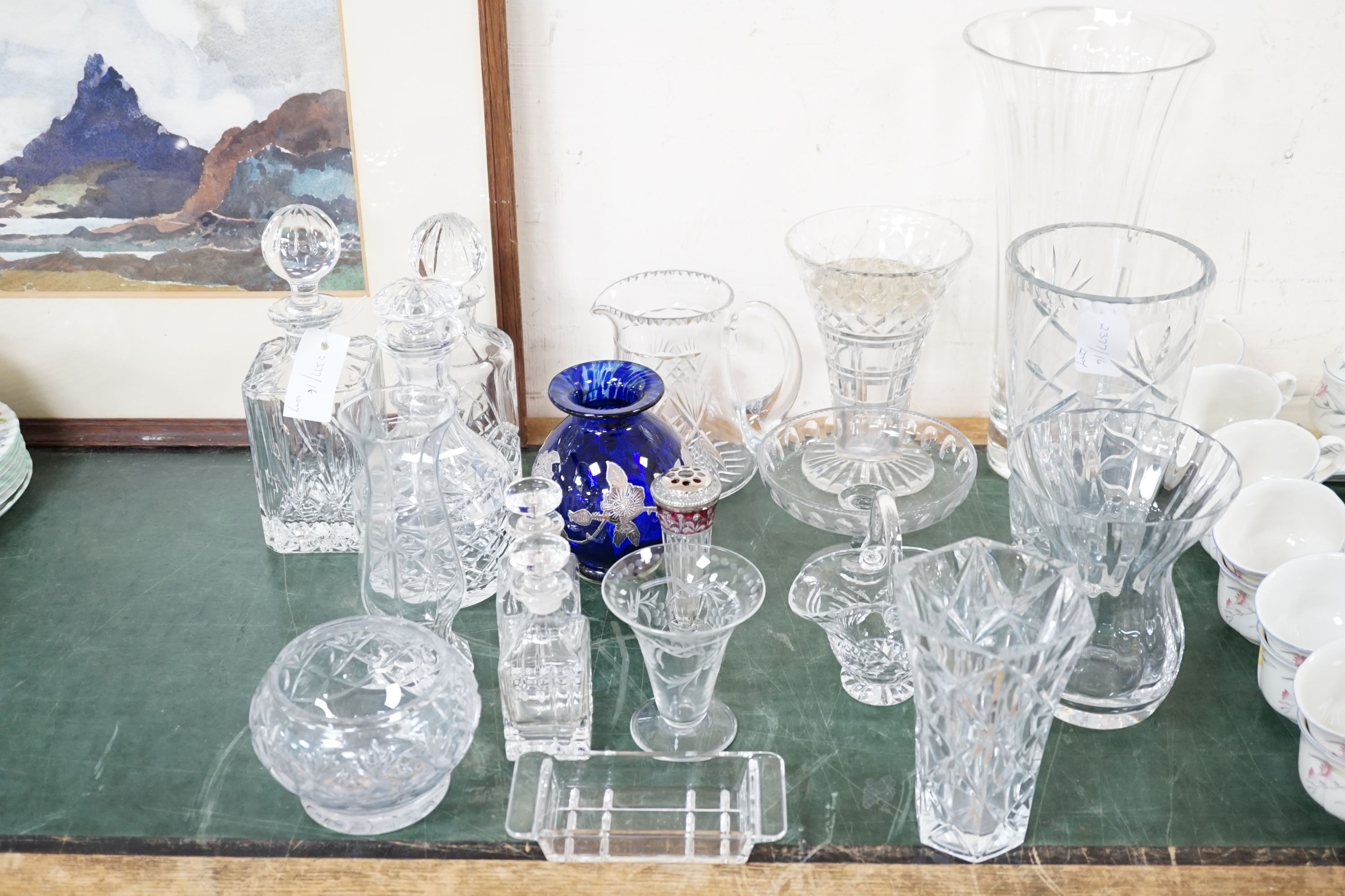 A quantity of cut crystal and other glassware to include decanters, vases, bowls etc